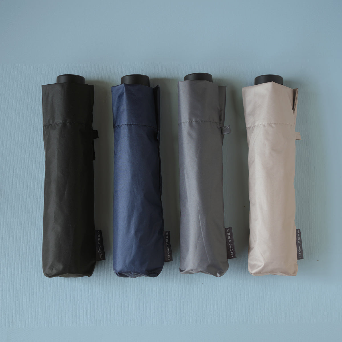 A 55cm folding umbrella that can be used in both rain and shine